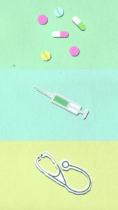 Overhead view of cutout paper appliques representing stethoscope near syringe and capsules with pills on colorful background