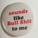 White button with red and black text