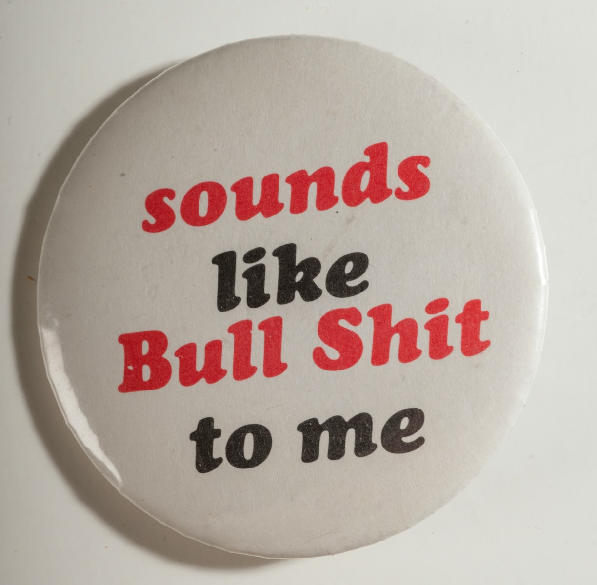 White button with red and black text
